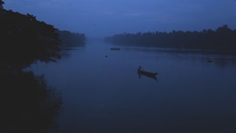 sunrise in backwaters,fishermen arriving shore,up angle view