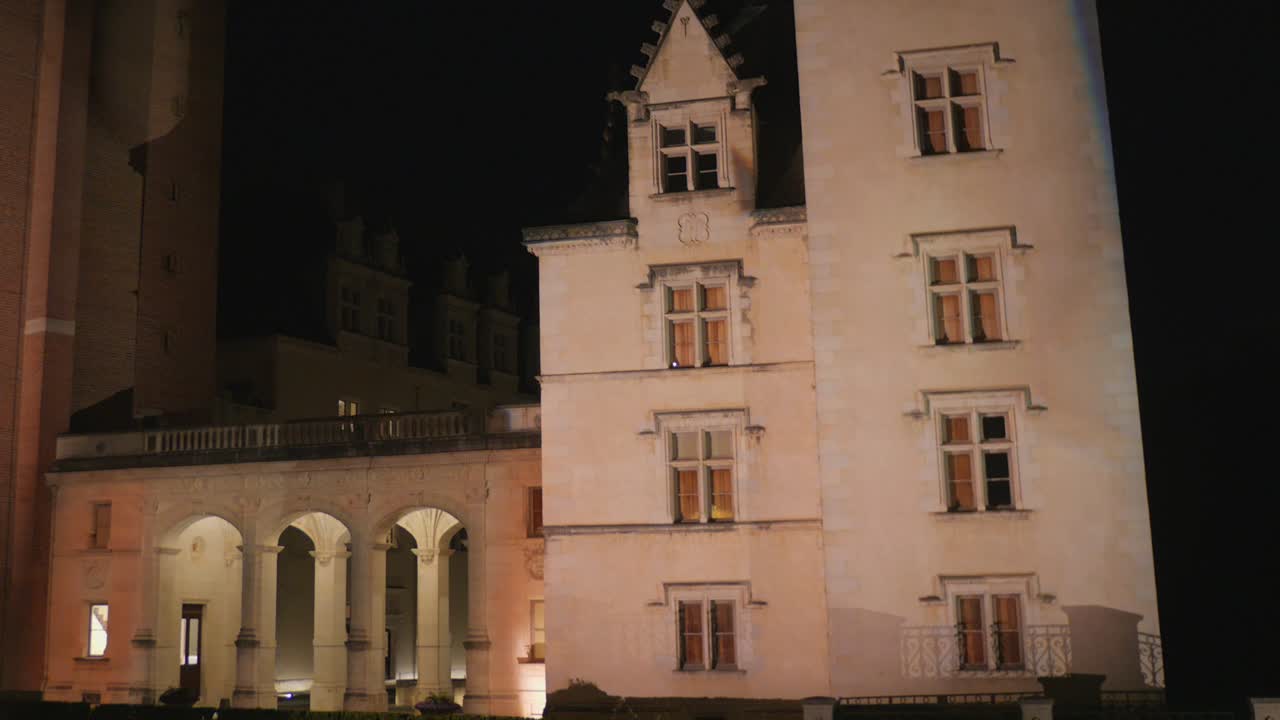 Pau Castle stands majestically under the night sky, showcasing its rich history and stunning architecture. The illuminated towers and walls create a captivating atmosphere in Pau, France