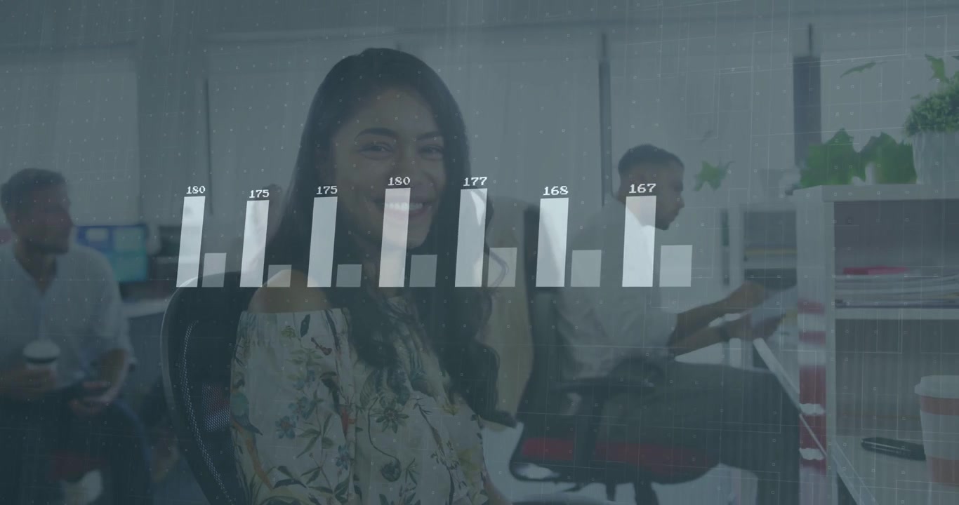 woman at desk typing while holding cup as peer tapping tablet causing business bar charts tracking