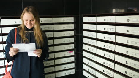 Young-woman-being-happy-with-received-letter