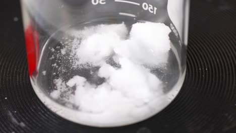 sodium acetate crystallizing in a beaker over time