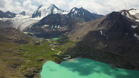 Aerial-drone-shot-of-the-mountain-range-beside-the-Ala-Kol-lake-in-Kyrgystan