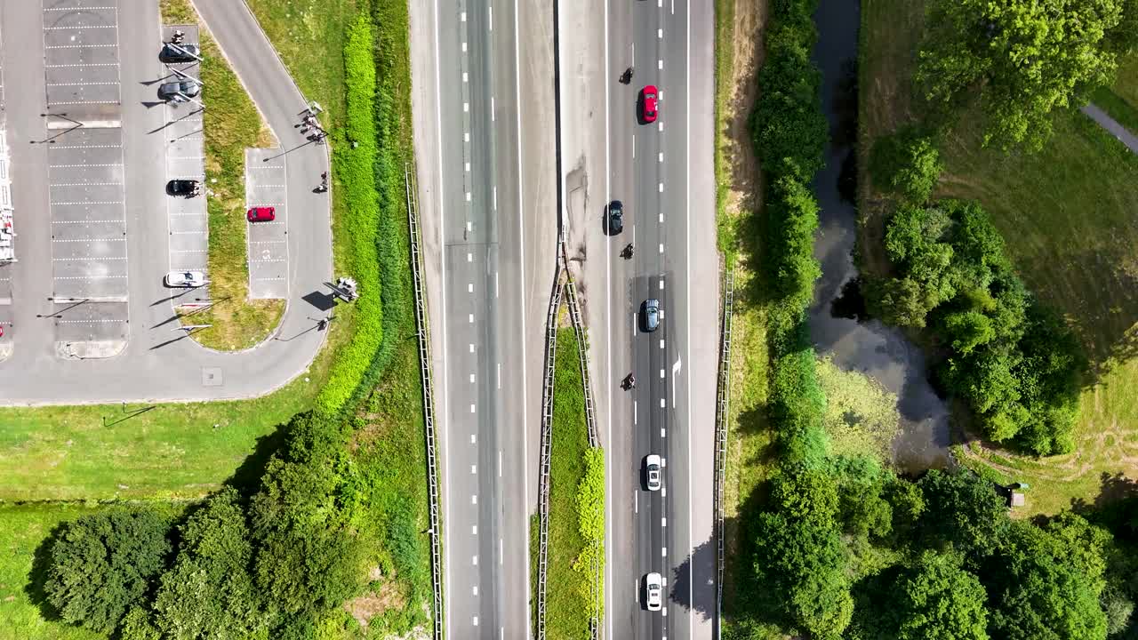 Highway and urban landscape with parking areas