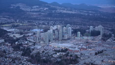 coquitlam, bc, city high-rise buildings aerial view at dusk