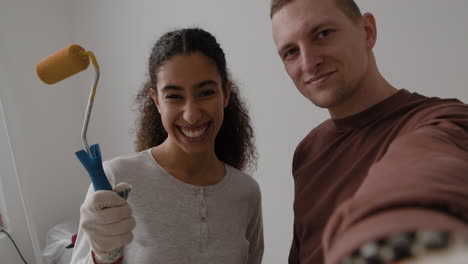 happy couple doing home renovation: diy project selfie