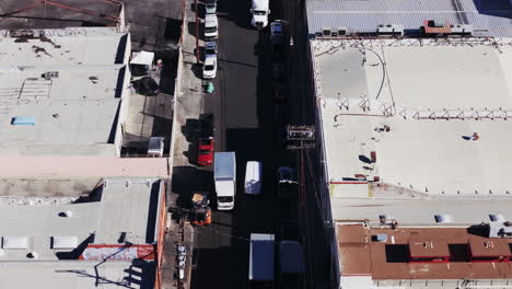 aerial view of a busy urban alley with commercial activity