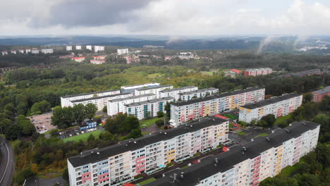 aerial birds eye view capturing rows of colorful pastel condominium in siriusgatan, bergsjon, gothenburg during the day with cloudy sky