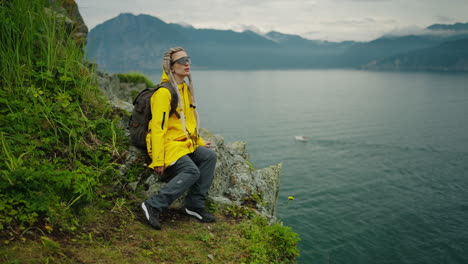 woman hiking in the mountains by a lake