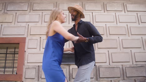 interracial couple dancing salsa in the old town street 17