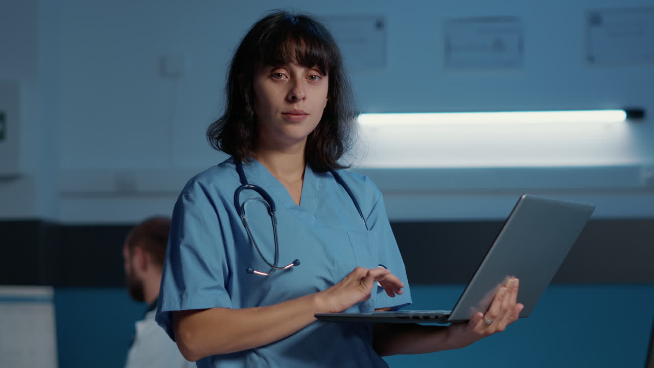 Nurse using laptop in hospital
