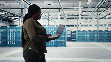smiling data center engineer pleased after minimizing downtime