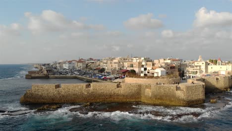 aerial footage over the old city of acre and the mediterranean sea