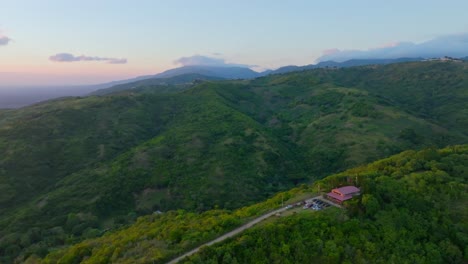 Aerial-View-Of-A-Vacation-House-Isolated-On-Forest-Mountains-In-Santiago-de-los-Caballeros,-Montanas,-Santiago,-Dominican-Republic