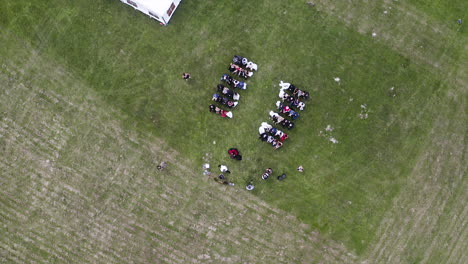 overhead view of an outdoor wedding ceremony in a grassy field,czechia