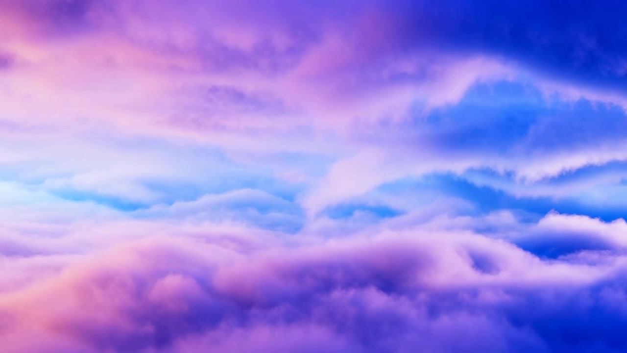 Layered cloudscape fills wide panoramic sky with billowy cumulus below, thinner stratocumulus bands above, and soft lavender, pink, and blue tones creating serene natural backdrop with airy depth
