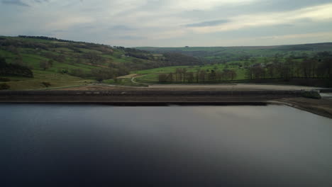 Establishing-Aerial-Drone-Shot-Over-Swinsty-Reservoir-Dam-Looking-Down-Valley-in-Yorkshire-UK