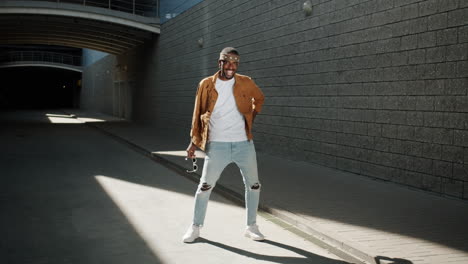 stylish man dancing in urban setting