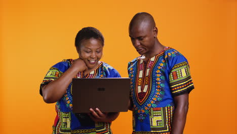 husband and wife searching information on online website
