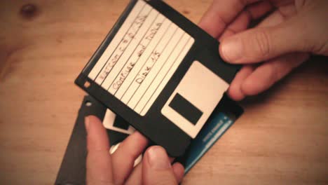 Hands Holding Floppy Disks