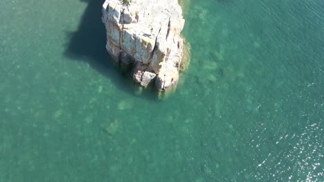 birds eye vie of a crystal clear blue- green water at lake superior on a sunny morning