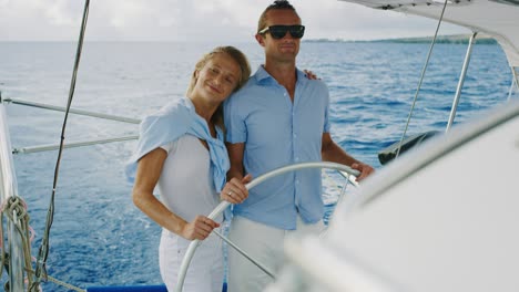 happy couple sailing on yacht