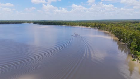 boat towing skier on scenic australian lake