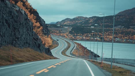 two-lane road following the alta fjord coastline