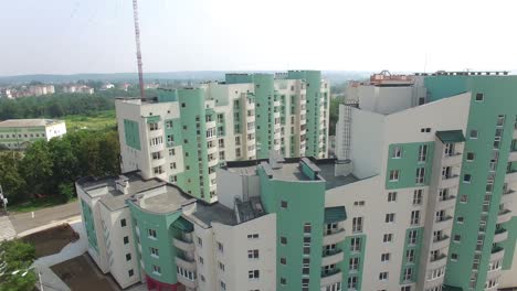 beautiful view opening of a modern building being built in a new residential complex. high-rise house apartment in the city. motion camera bottom top