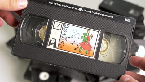 vhs cassette with a drama label stuck on it