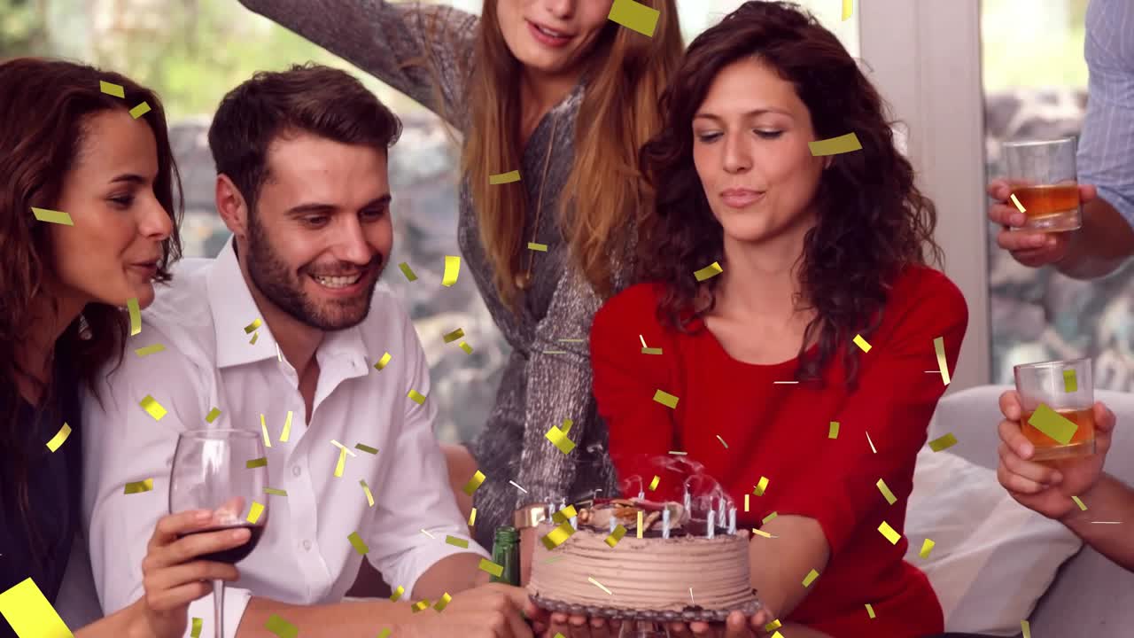 Friends cheering woman in red leaning blowing out birthday candles animated confetti on cake events