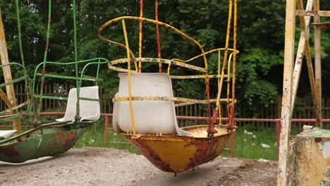 abandoned and empty amusement park swinging ship in the chernobyl