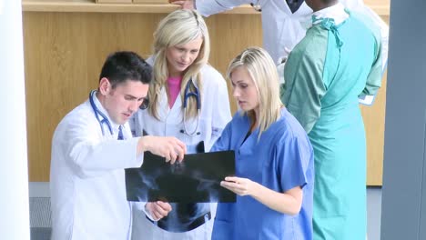 footage of doctors examining an xray