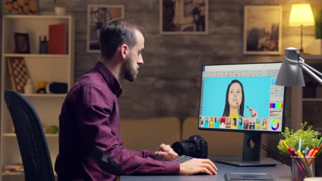 Young-creative-photographer-working-on-a-photo-on-computer