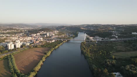 cable-stayed superstructure over mondego river rainha santa isabel bridge in the coimbra city of portugal, aerial view