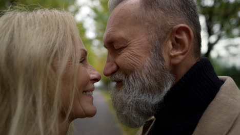 Portrait-of-happy-couple-smiling-romantically.-Cheerful-elderly-man-and-woman.