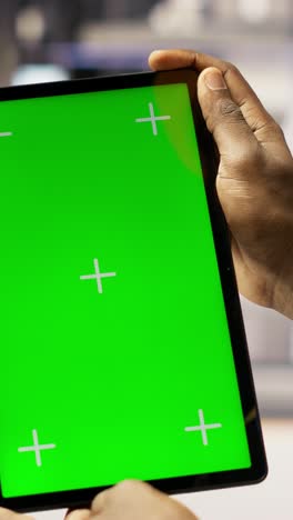 vertical video solar panels plant technician uses green screen tablet to oversee systems