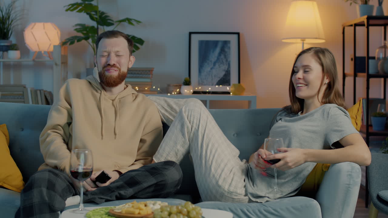 Couple Relaxing at Home with Wine