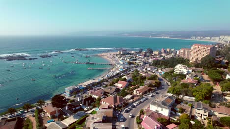Aerial-rotating-shot-of-the-port-with-boats-docked-within-Algarrobo,-Chile