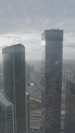 high-rise buildings in a city skyline on an overcast day