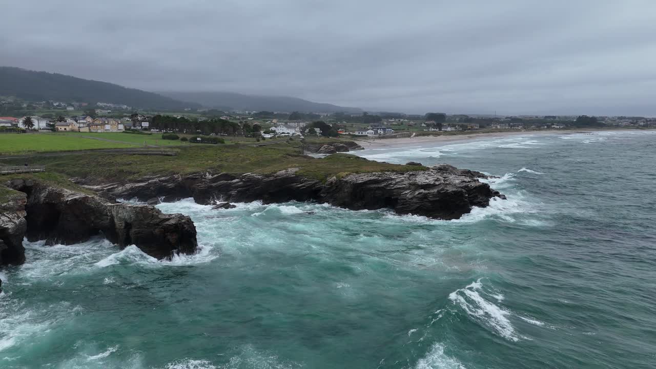 Stormy seas waves crashing on rocky coast Northern Spain drone,aerial