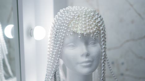 mannequin head with pearl headpiece