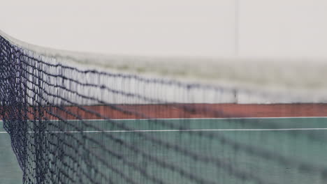 animation of envelope icon over net at tennis court