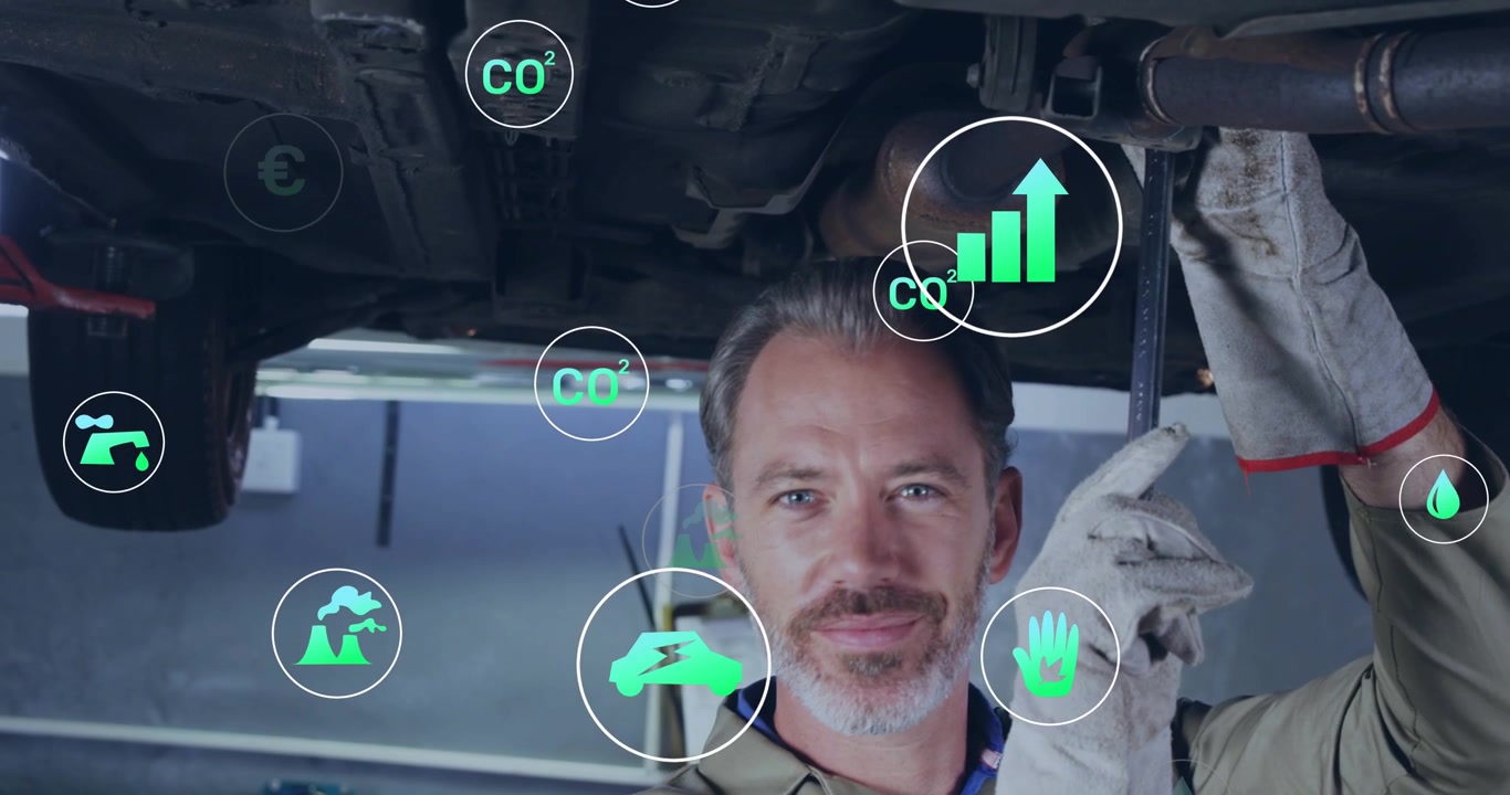 Meccanico che allinea una chiave inglese sotto il ponte sollevatore e applica coppia, mentre le icone del grafico CO2 euro si spostano indicando l'efficienza.