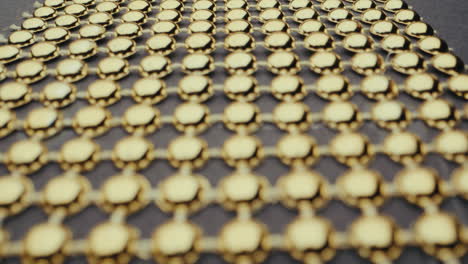 gold bead pattern on a dark background