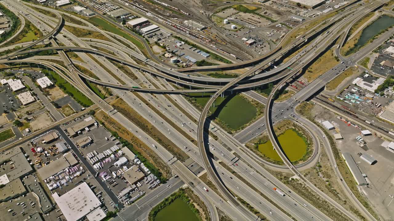 Traffic crossing on complex highway with downtown cityscape