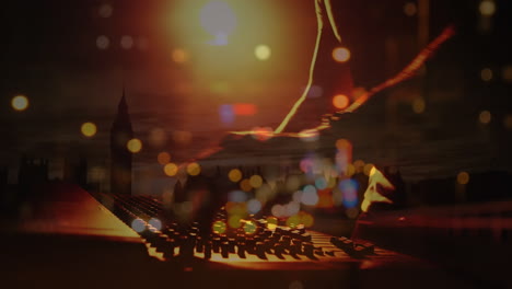 animation of blured road traffic over hand of caucasian male dj and console