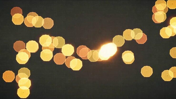 Lens adjusting, warm bokeh discs shifting clustering forming bright core in studio, polygonal edges
