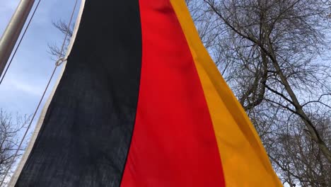 close up german flag flying in wind