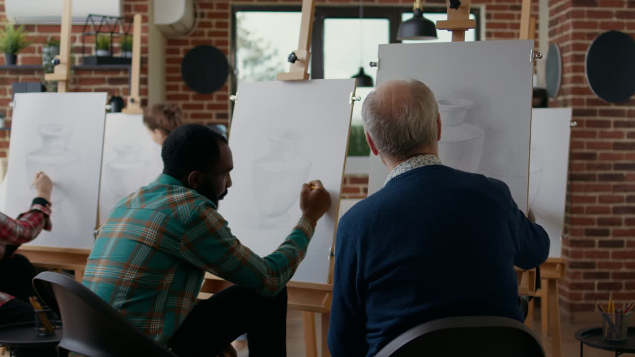 Diverse team of men attending art class lesson together