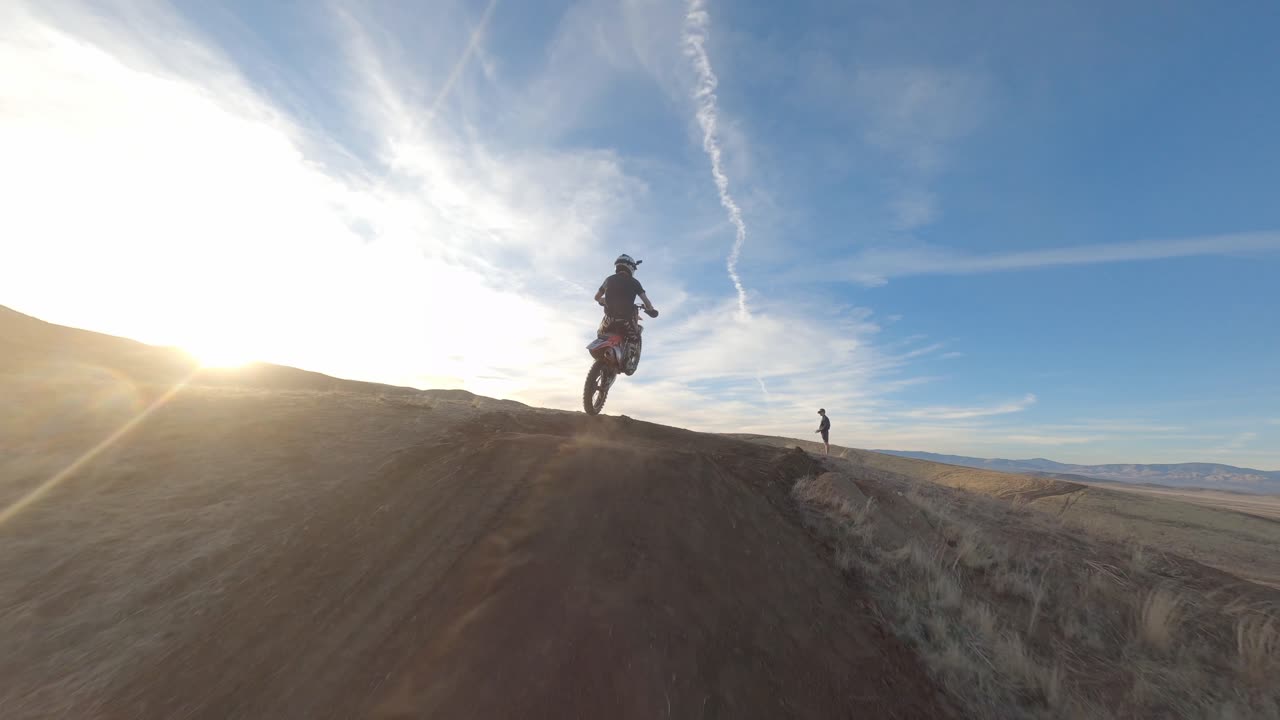 High speed drone chase on a dirt bike rider going off a jump